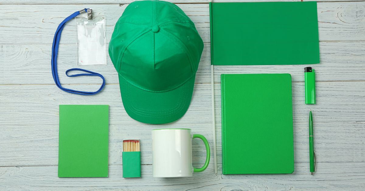 Blank green hat, folder, notebook, matches, lighter and pen all await a corporate logo to be sent out as gifts.