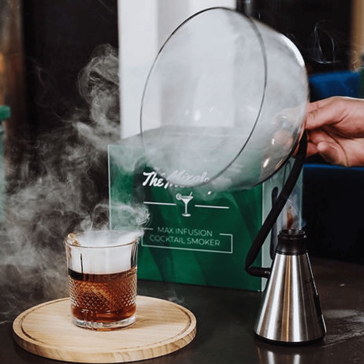 Cocktail being smoked by Max Infusion Cocktail Smoker