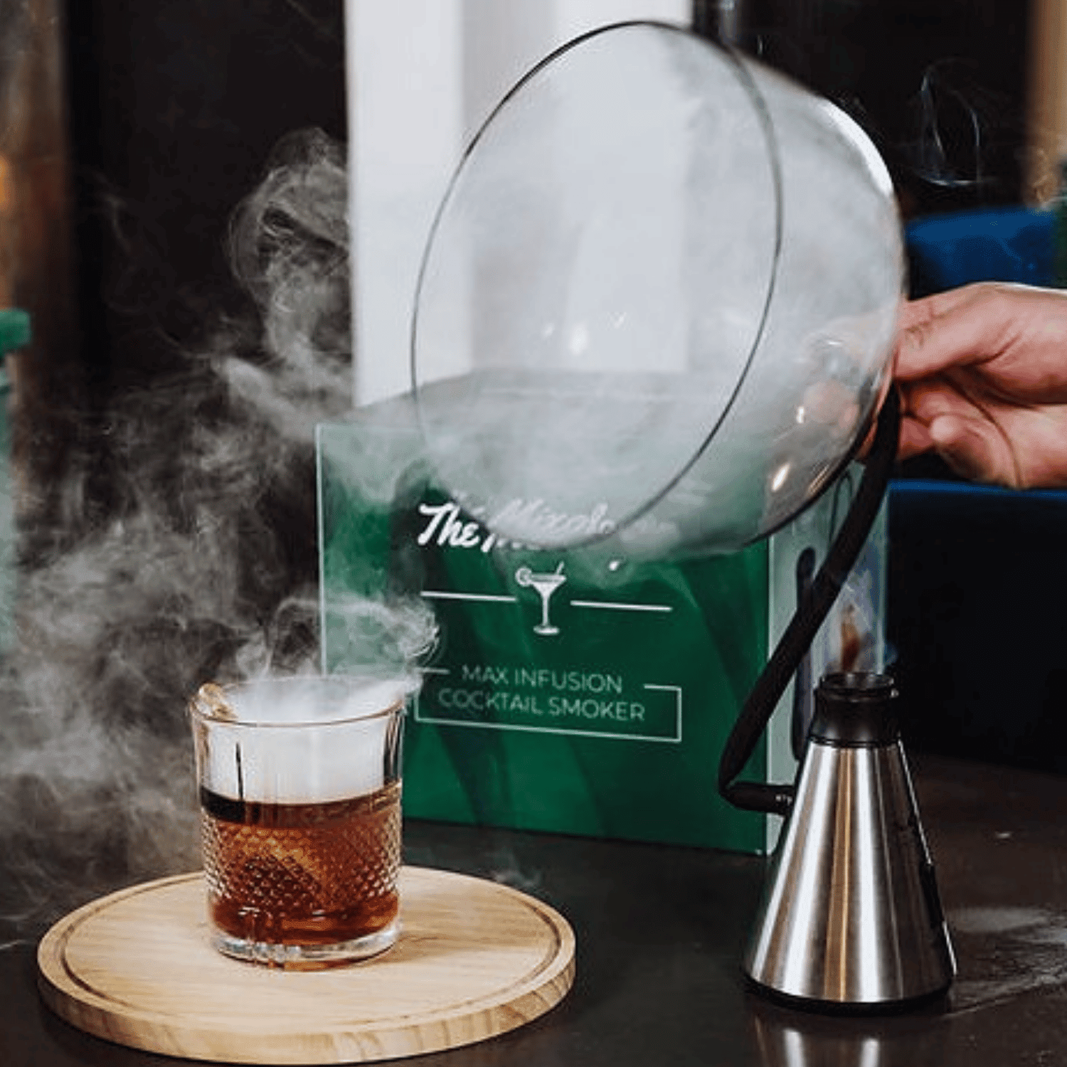 Cocktail being smoked by Max Infusion Cocktail Smoker